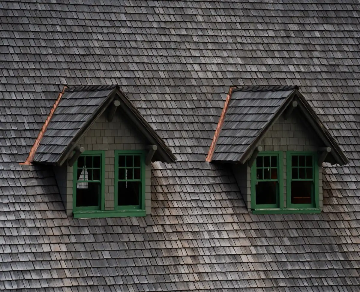 Dormers on a shingle roof in Menifee, CA, where step flashing and kickout flashing carry water past the walls